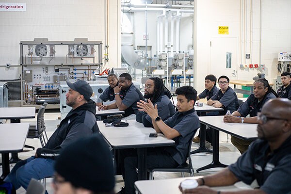Students from Kennedy King Community College listen as speakers discuss the program