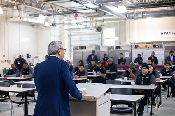Students from Kennedy King Community College listen as speakers discuss the program