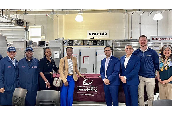 Leaders from Johnson Controls and Kennedy King Community College celebrate the HVAC program