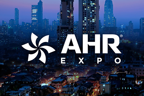 Night view of modern buildings with AHR Expo text written 