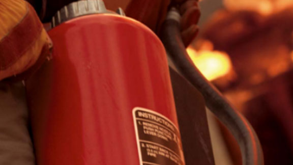 firefighter with extinguisher closeup