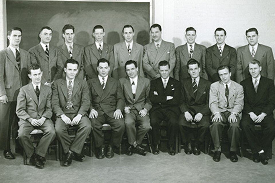 A group of Johnson Service Company employees sitting, posing for the photograph