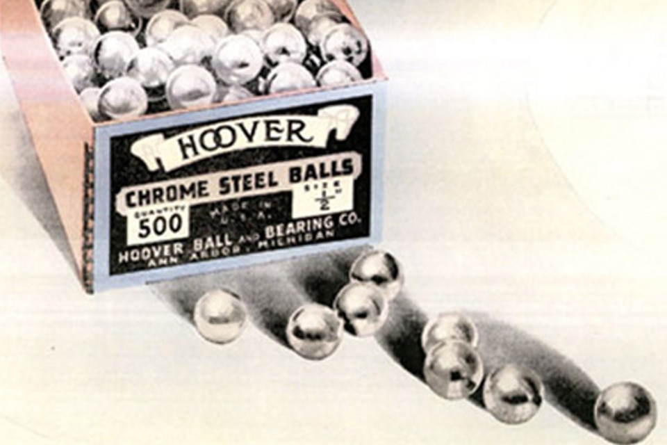A open box of Hoover Chrome Steel Balls with a few steel balls next to the box