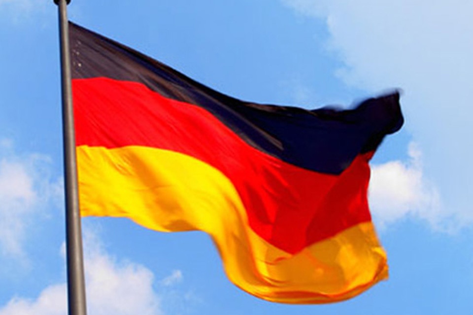 The flag of Germany waving against the sky