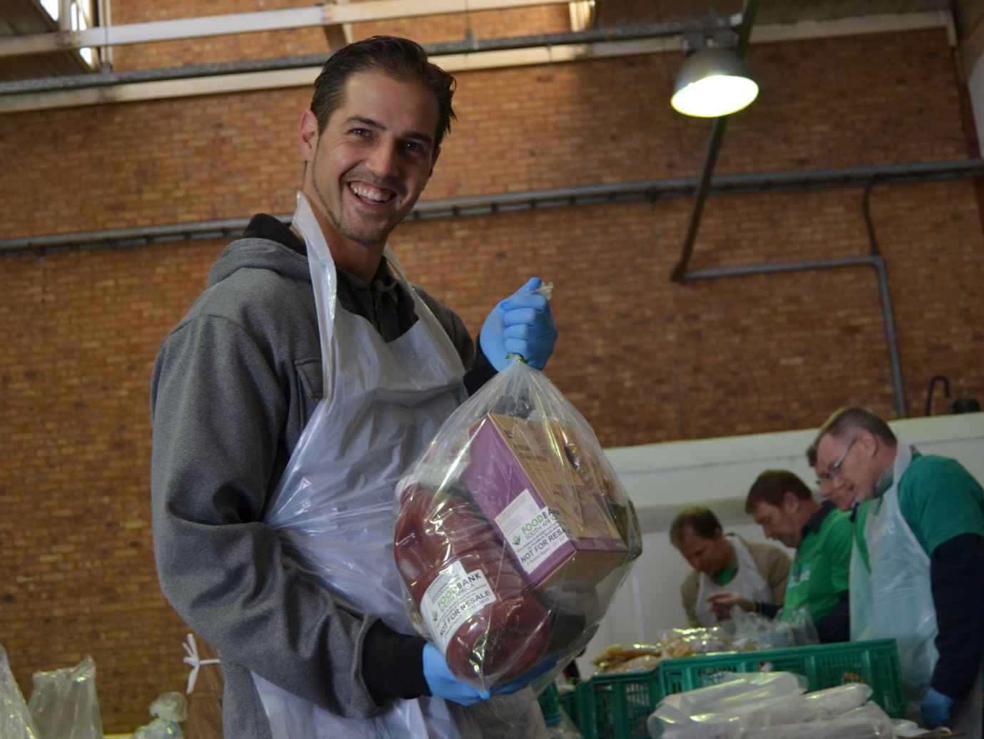 Smiling man organising food essentials