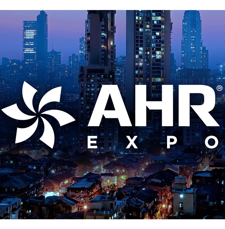 Night view of modern buildings with AHR Expo text written 