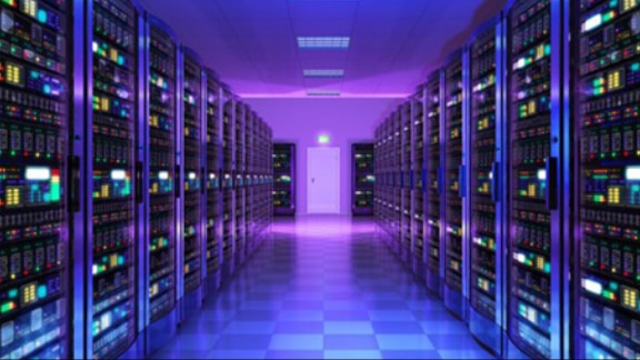 Interiors of a data centre with purple lighting racks on either side