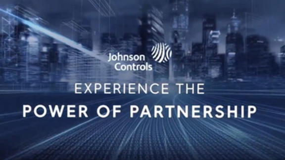 Johnson Controls Logo with text 'Experience the power of partnership' on a cityscape background