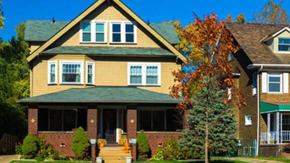 A house with a porch and garden in the front