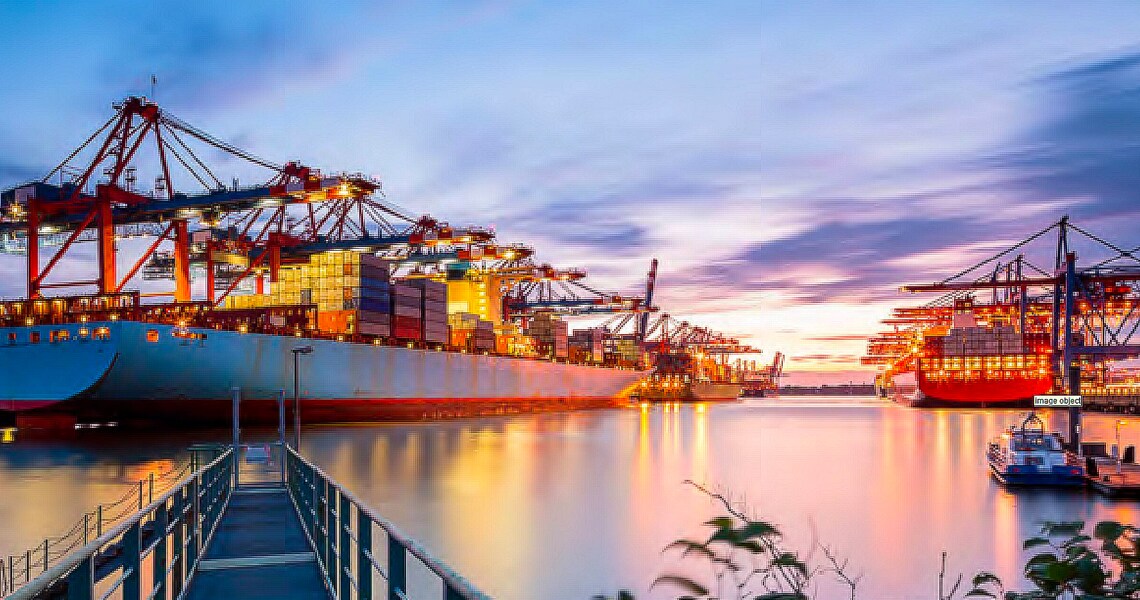Container cargo ships in shipyard at dusk