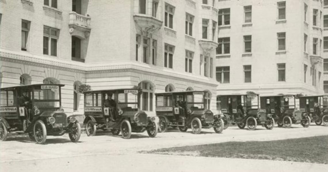A fleet of Johnson Controls postal trucks