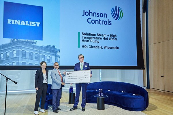 Kate Frucher (left), Managing Director and Board Member, The Clean Fight presenting Rajesh Dixit (center), director of product management, Johnson Controls and Ian Casper, vice president, engineering, Global Products, Johnson Controls with the Empire Tech