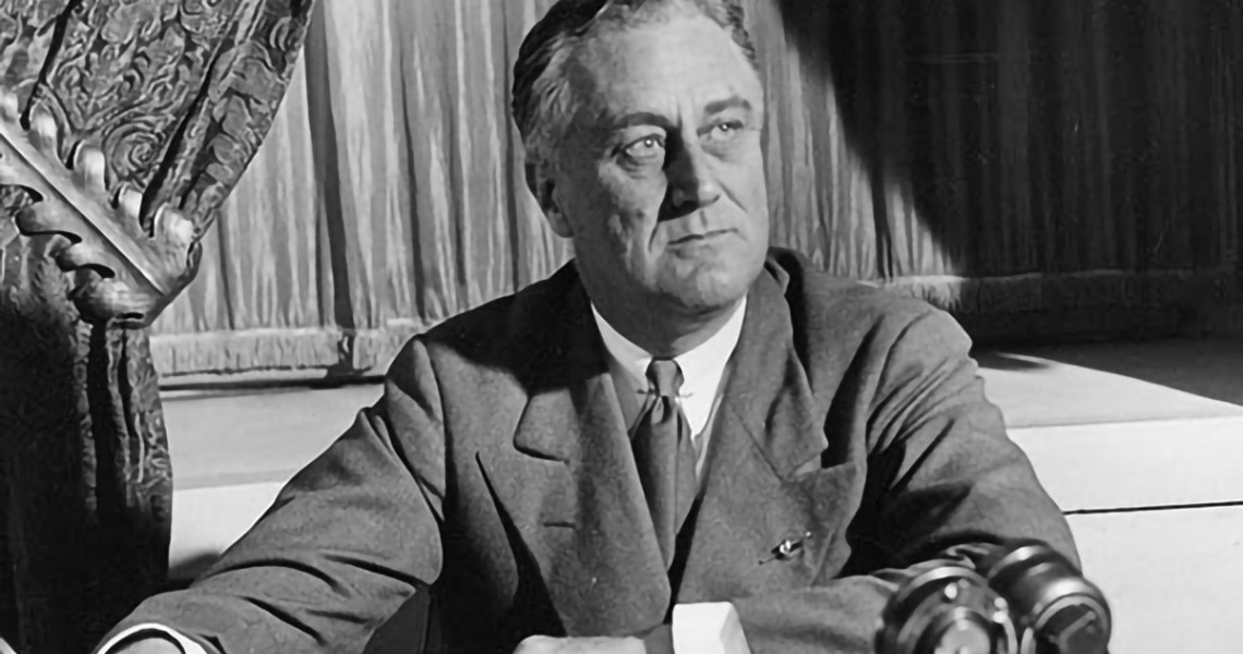 American President Franklin Roosevelt seated at a desk