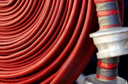 coiled red hose reel closeup