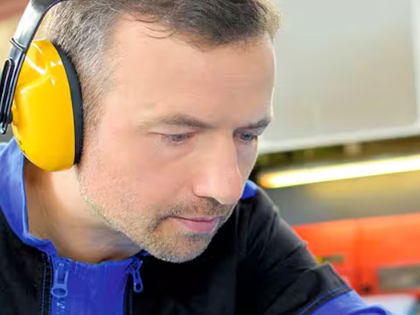 man wearing yellow headphones 