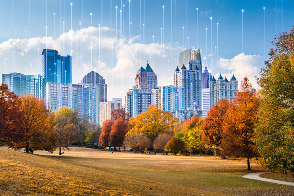 Piedmont Park skyline in autumn, overlaid with a graphic of transmission nodes