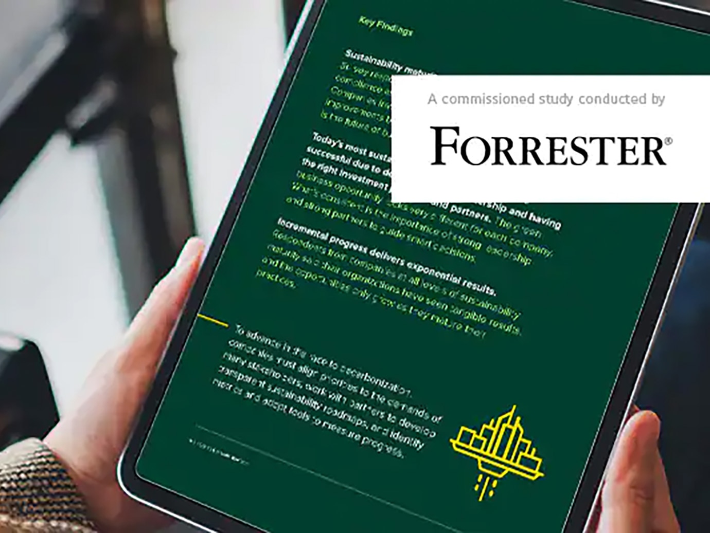 A person reading a Forrester case study on a tablet
