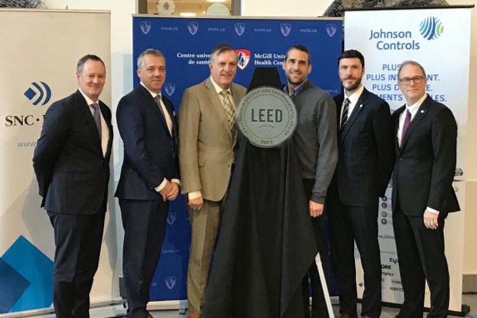 Stephane Couture, Regional Director, Johnson Controls with McGill University officials at their second LEED Gold certification