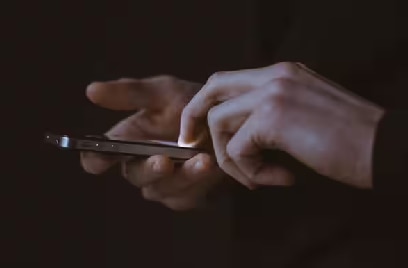 Close-up of a person's hands holding a smartphone