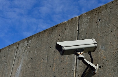 A video surveillance camera on a concrete wall