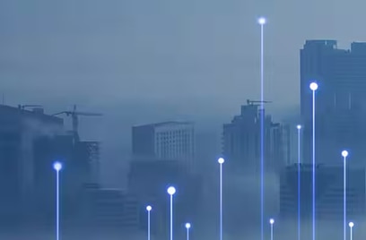 A cityscape covered in fod, overlaid with OpenBlue graphic