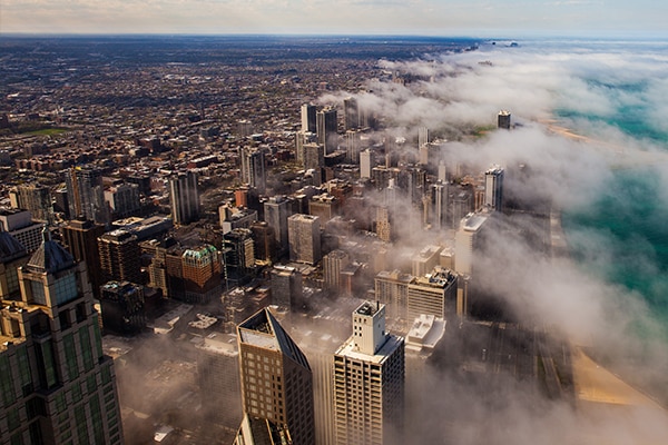 Aerial view Chicago's skyline, partially covered by clouds