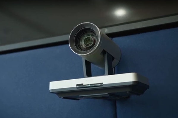 Close-up of a security camera in a building